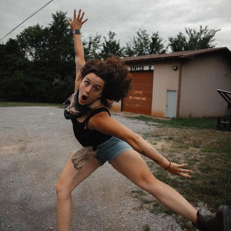 Kaveri Mehta, Lead Design Curator at Ocean Frame Folio, reviewing corporate floral arrangements